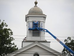 Front view of Presbyterian Church in Basking Ridge from Oak Street during painting. 