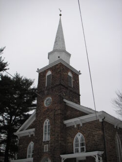 full view of front of church and steeple from street, before restoration of church steeple