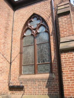 View of cathedralnwindow, restored wood frame