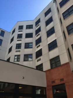View of The Heritage from the plaza before painting.